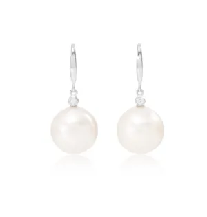 Stella cultured freshwater pearl drop earrings with delicate cubic zirconia above on silver hooks