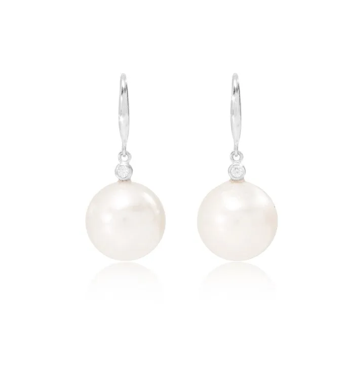 Stella cultured freshwater pearl drop earrings with delicate cubic zirconia above on silver hooks